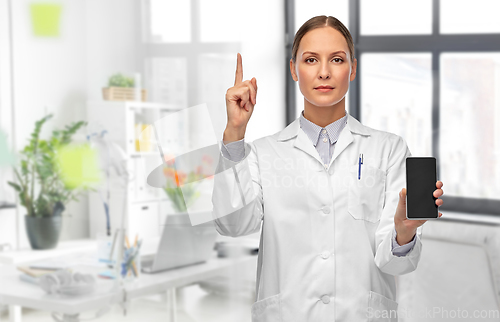 Image of female doctor with smartphone at hospital