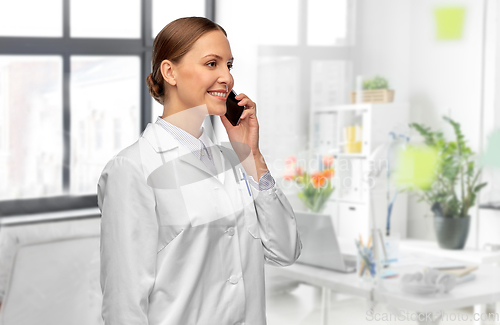 Image of female doctoror calling on smartphone at hospital