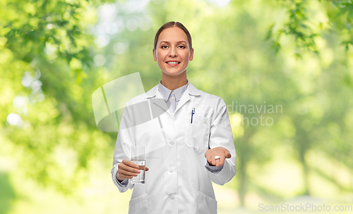 Image of doctor with medicine and glass of water