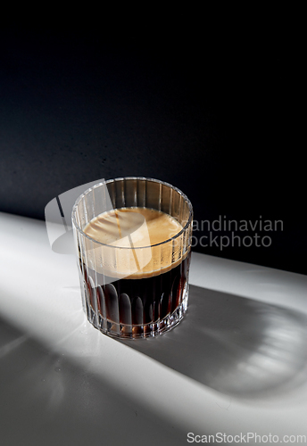 Image of glass of coffee on table