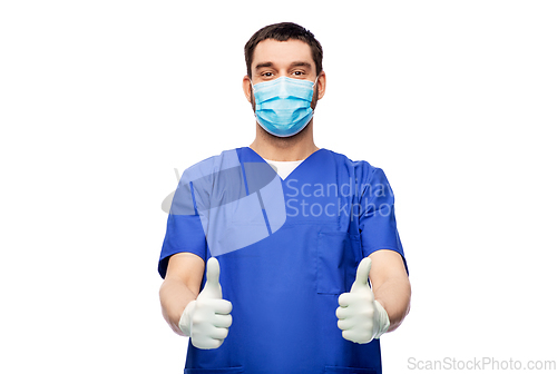 Image of male doctor in mask showing thumbs up