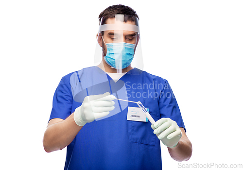 Image of male doctor in mask with cotton swab and test tube