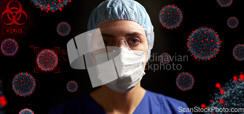 Image of female doctor or nurse in goggles and face mask