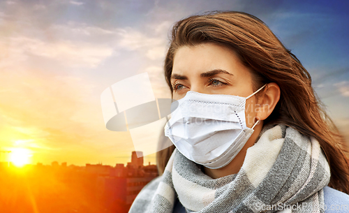 Image of young woman wearing protective medical mask