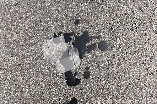 Image of hole in asphalt