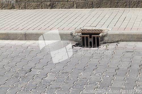 Image of metal sewer grating