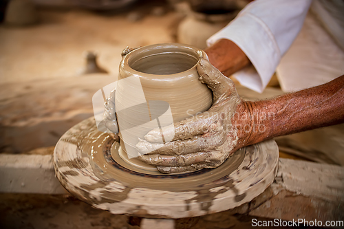 Image of Potter at work makes ceramic dishes. India, Rajasthan.