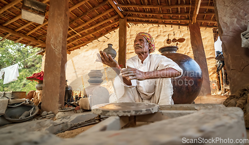 Image of Potter at work makes ceramic dishes. India, Rajasthan.