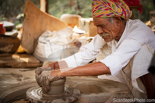 Image of Potter at work makes ceramic dishes. India, Rajasthan.