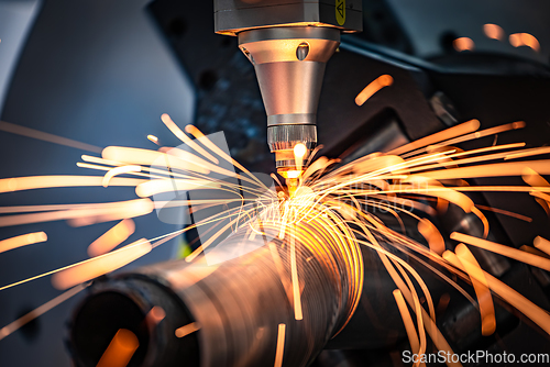 Image of CNC Laser cutting of metal, modern industrial technology.