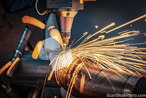 Image of CNC Laser cutting of metal, modern industrial technology.