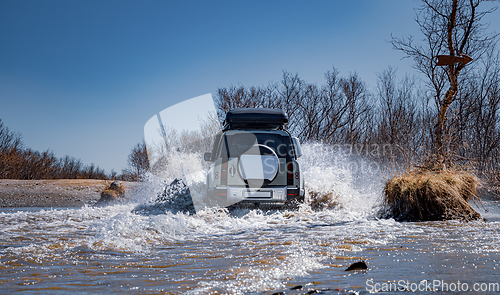 Image of Off road tourist car rides off-road in the highlands. Expedition