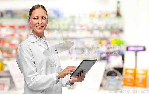 Image of female doctor with tablet pc at pharmacy