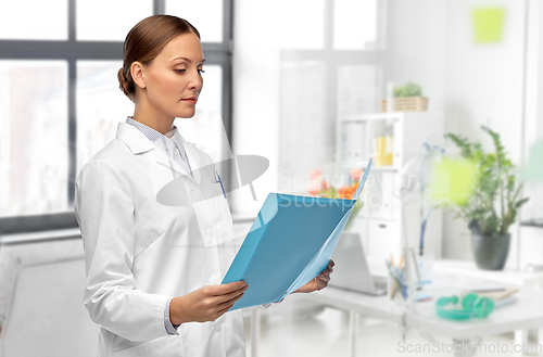 Image of female doctor with folder at hospital