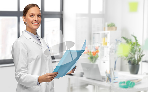 Image of female doctor with folder at hospital