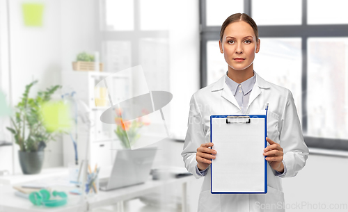 Image of female doctor with clipboard at hospital