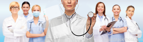 Image of close up of female doctor with stethoscope