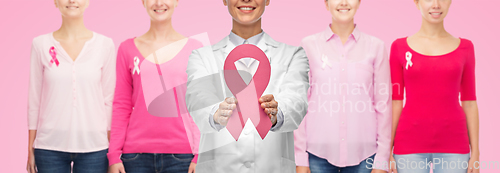 Image of female doctor with breast cancer awareness ribbon