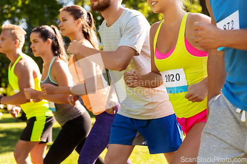 Image of sportsmen with badge numbers on start of race