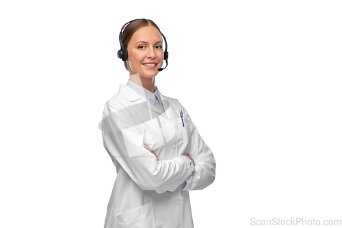 Image of smiling female doctor in coat with headset