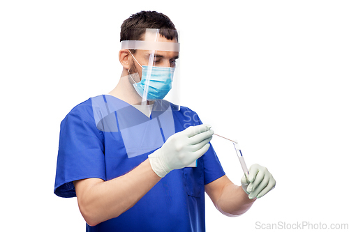 Image of male doctor in mask with cotton swab and test tube
