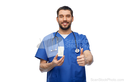 Image of male doctor with medicine showing thumbs up