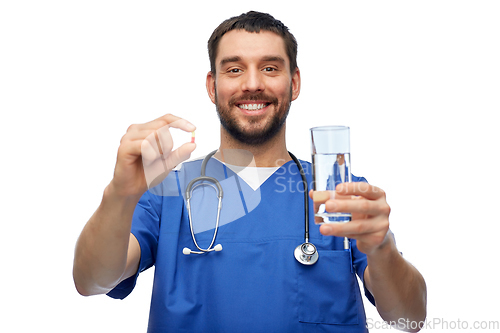 Image of doctor or male nurse with medicine and water