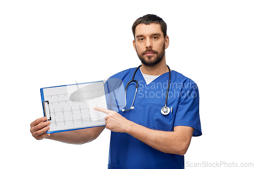 Image of male doctor with cardiogram on clipboard