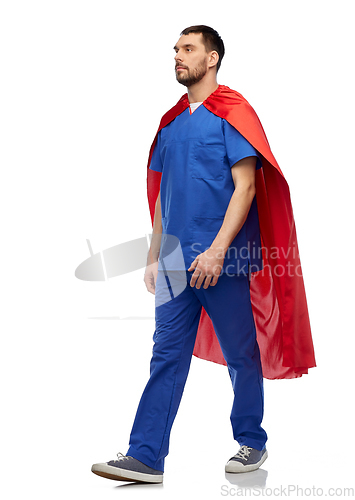 Image of doctor or male nurse in superhero cape walking