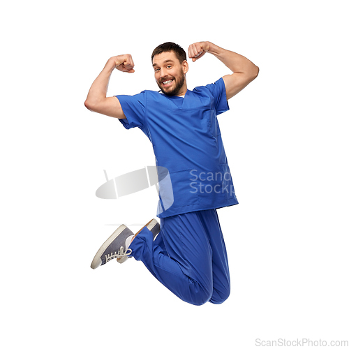 Image of happy smiling doctor or male nurse jumping in air