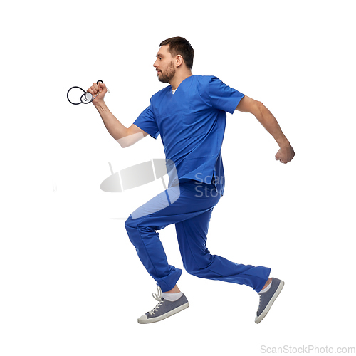 Image of doctor or male nurse with stethoscope jumping