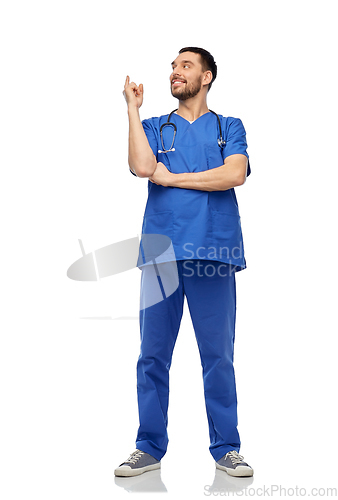 Image of smiling doctor or male nurse pointing finger up