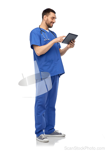 Image of smiling doctor or male nurse using tablet computer