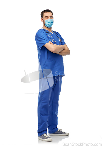 Image of male doctor in blue uniform and mask