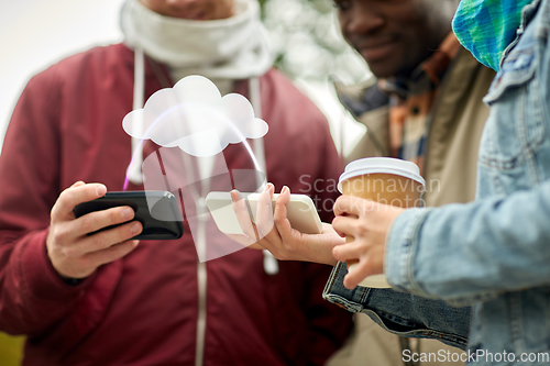 Image of friends transfering data from smartphones