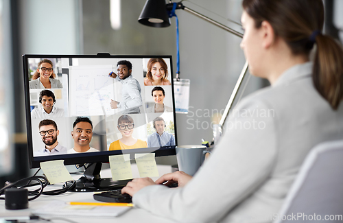 Image of businesswoman having video conference on computer