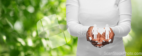 Image of close up of african american woman holding couple