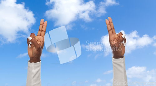 Image of hands of african american woman showing fingers