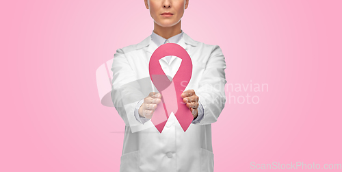 Image of female doctor with breast cancer awareness ribbon