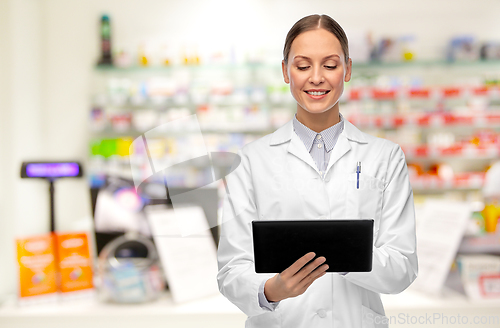 Image of female doctor with tablet pc at pharmacy