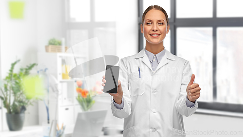 Image of female doctor with smartphone showing thumbs up