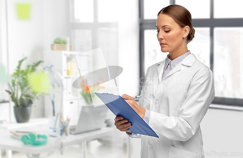 Image of female doctor with clipboard at hospital