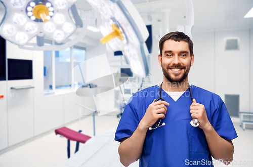 Image of smiling doctor or male nurse with stethoscope