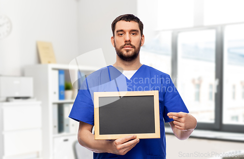 Image of male doctor or nurse with chalkboard