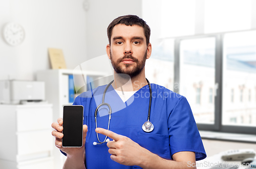 Image of doctor or male nurse with smartphone