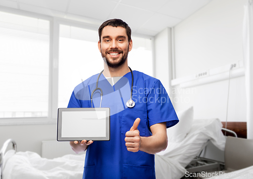 Image of male doctor with tablet pc showing thumbs up