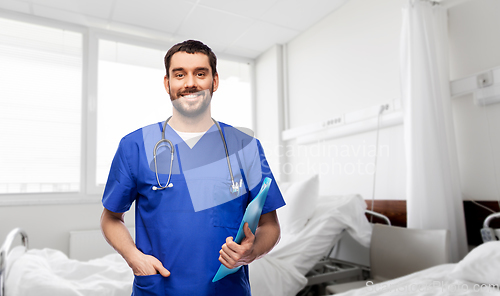 Image of smiling doctor or male nurse with folder