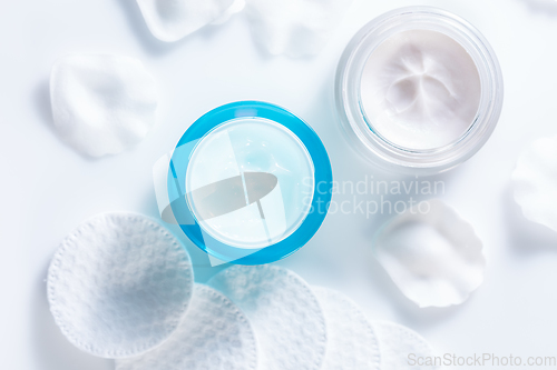 Image of Moisturizing cosmetic day and night creams with cotton pads