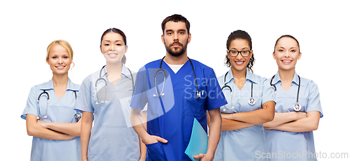 Image of doctor or male nurse with group of medical workers