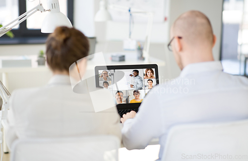 Image of business team having video conference at office